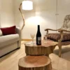 Lampadaire en bois abat jour voile de bateau et table basse